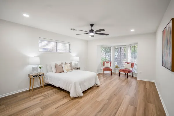 a bedroom with a bed and a table in it