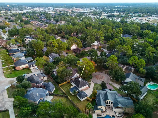 an aerial view of residential houses with outdoor space