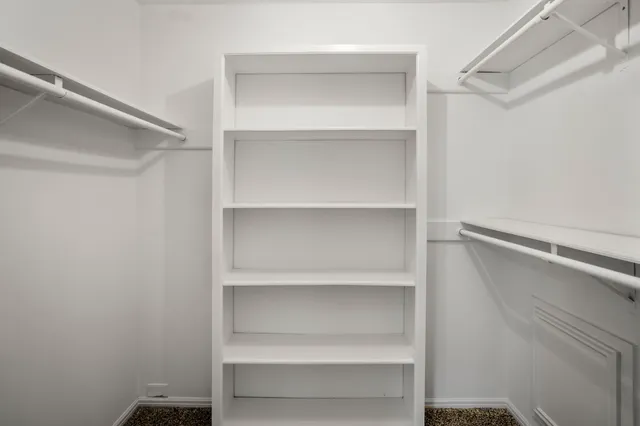 a view of an empty walk in closet