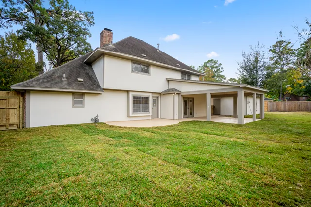 a view of a yard with a house and a garden