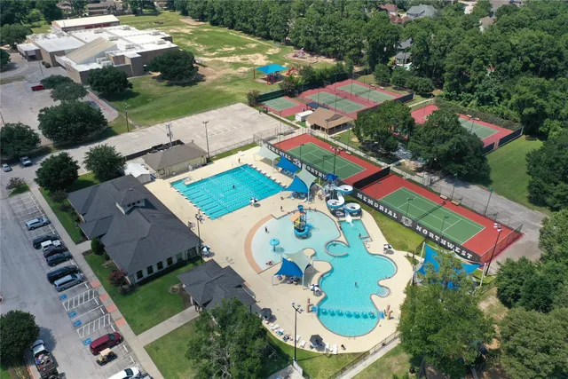 an aerial view of residential house with outdoor space and pool