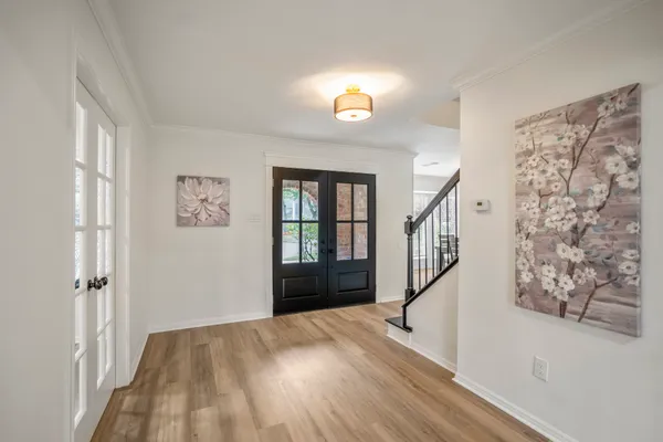 a view of entryway with wooden floor