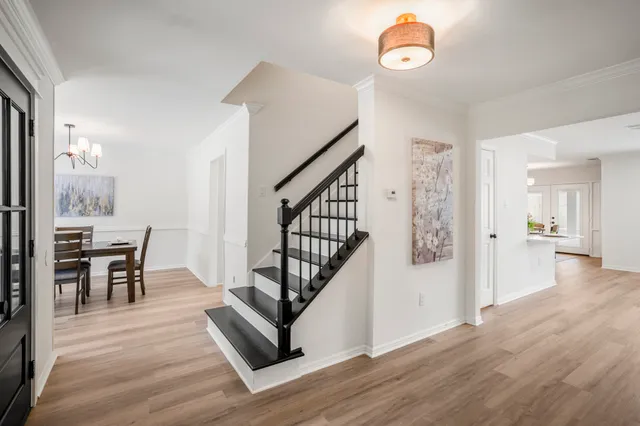 a view of dining room with furniture and wooden floor
