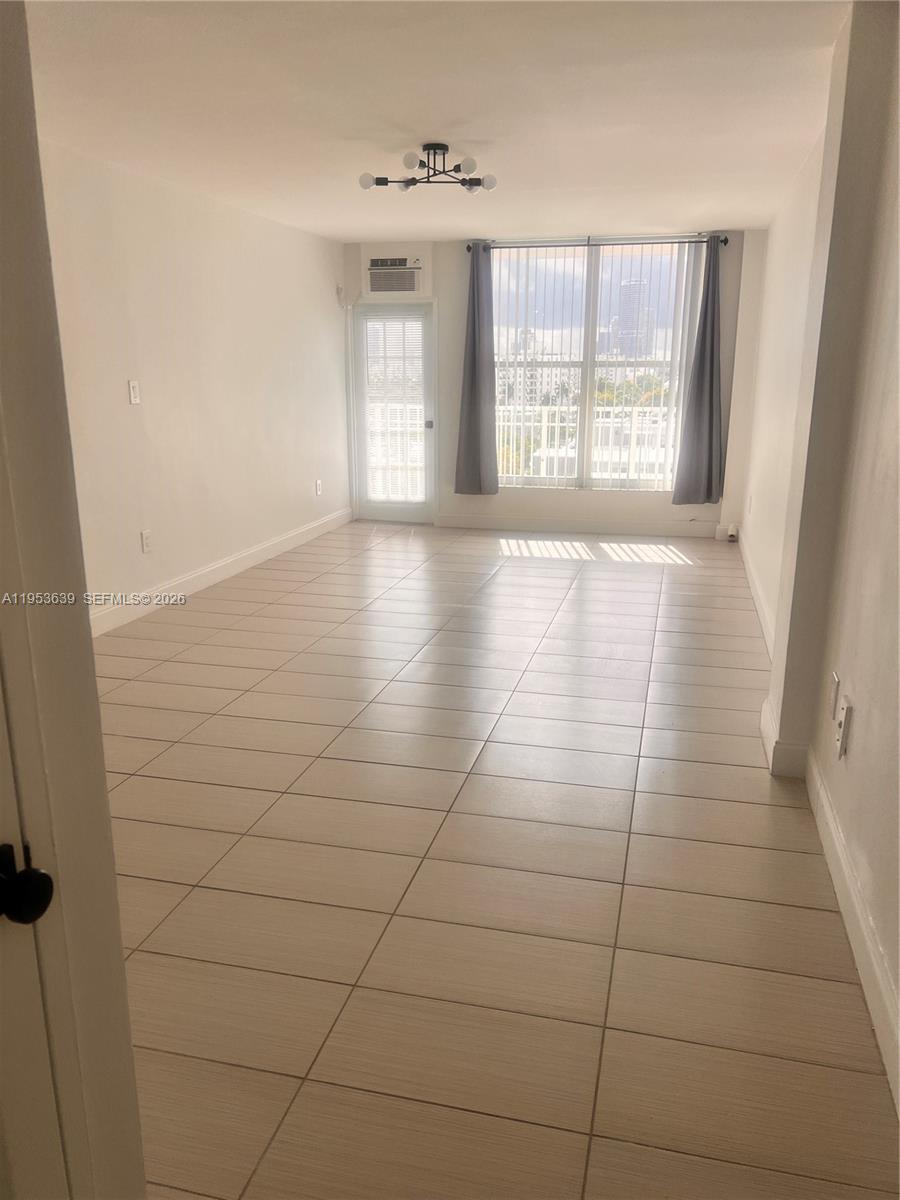 1300 Lincoln Road, Unit B902 Miami Beach, FL 33139 - Photo 3 of 17 a view of an empty room with a window