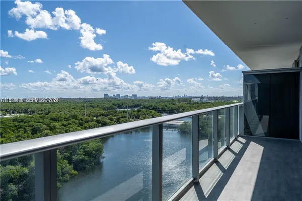 a view of a balcony with wooden floor