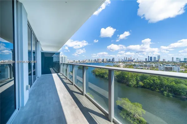 a view of a balcony with dining space