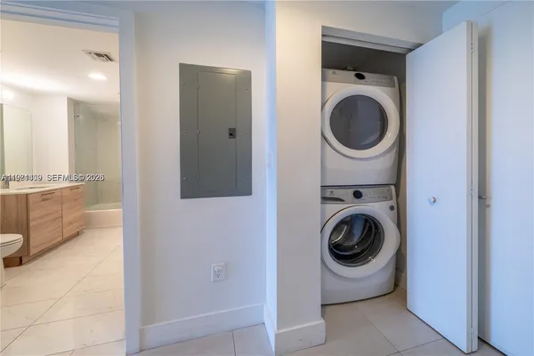 a view of a hallway with washer and dryer