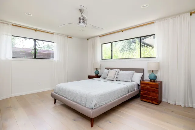 a bedroom with a bed and window