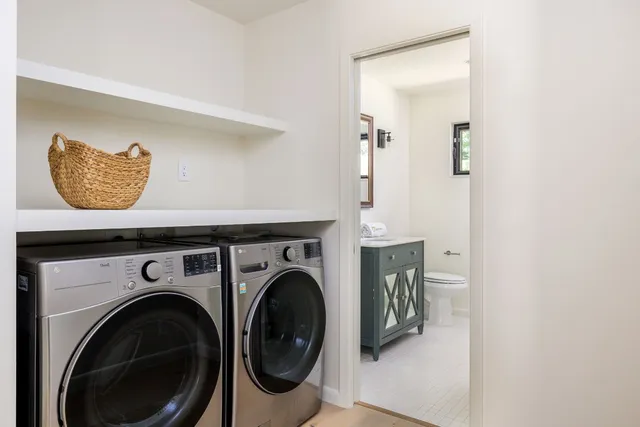 a view of livingroom with washer and dryer