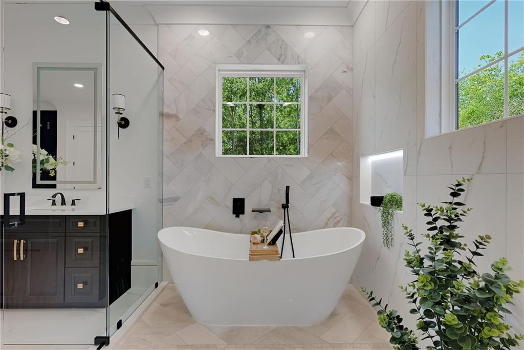 2366 Wall Road Monroe, GA 30656 - Photo 130 of 186 a bathroom with a bathtub and potted plant
