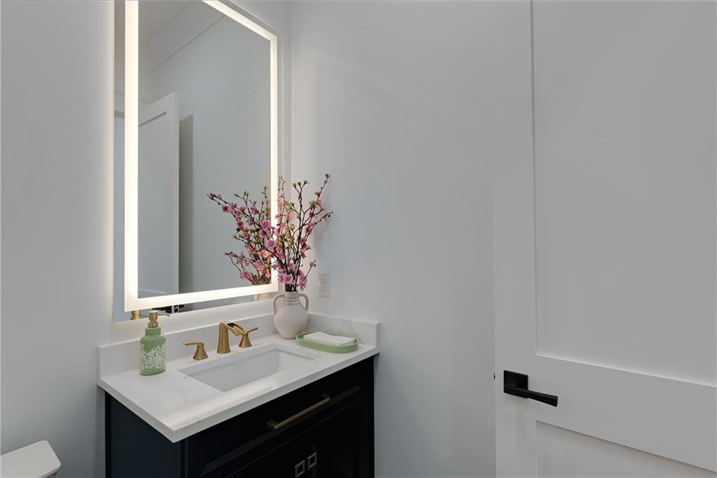 2366 Wall Road Monroe, GA 30656 - Photo 141 of 186 a bathroom with a sink and a mirror