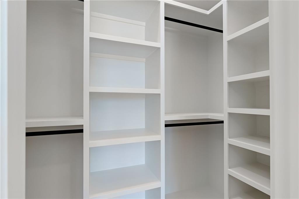 2366 Wall Road Monroe, GA 30656 - Photo 155 of 186 a view of walk in closet with empty racks