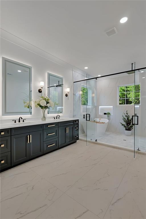 2366 Wall Road Monroe, GA 30656 - Photo 175 of 186 a spacious bathroom with a double vanity sink and a mirror