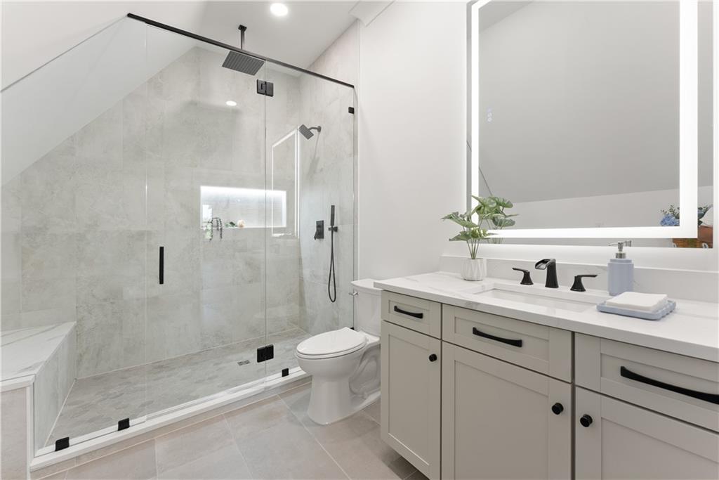 2366 Wall Road Monroe, GA 30656 - Photo 34 of 186 a bathroom with a granite countertop sink toilet and shower
