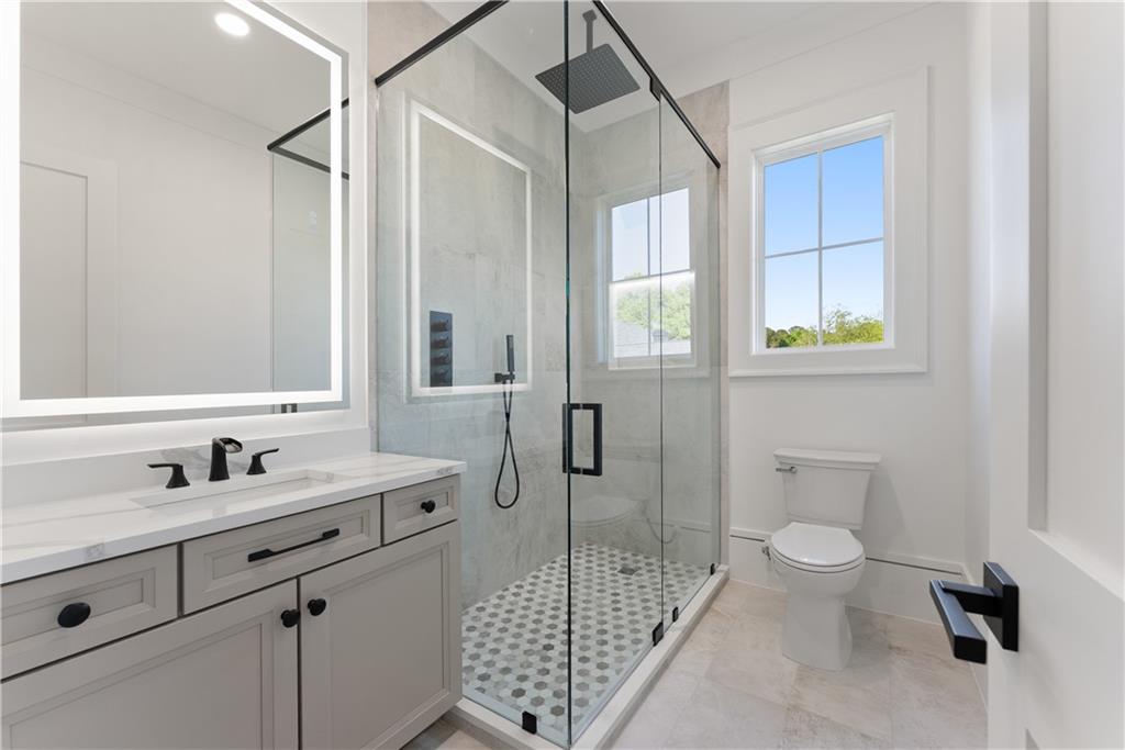 2366 Wall Road Monroe, GA 30656 - Photo 46 of 186 a bathroom with a sink a toilet and shower