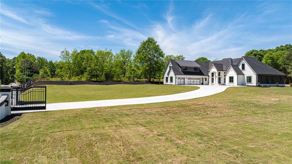 2366 Wall Road Monroe, GA 30656 - Photo 58 of 186 a view of swimming pool with lawn chairs and large trees