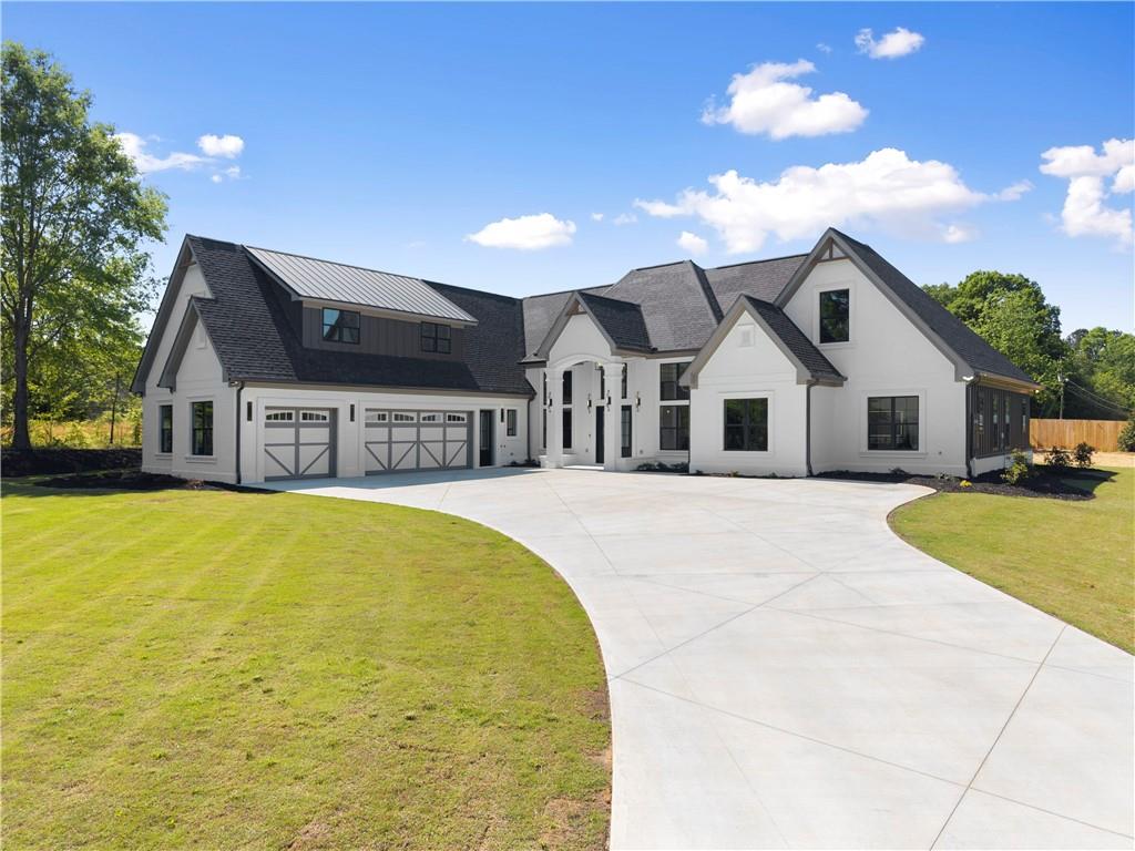 2366 Wall Road Monroe, GA 30656 - Photo 6 of 186 a front view of a house with swimming pool having outdoor seating