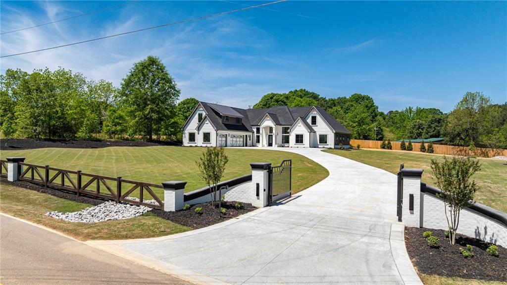 2366 Wall Road Monroe, GA 30656 - Photo 62 of 186 a view of a swimming pool with a lounge chairs