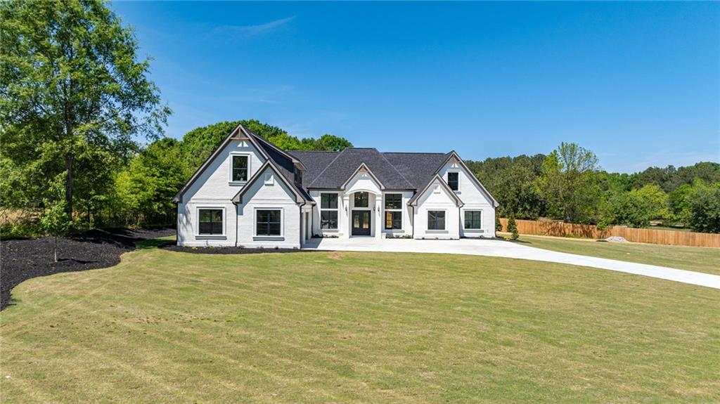 2366 Wall Road Monroe, GA 30656 - Photo 66 of 186 a front view of a house with a garden