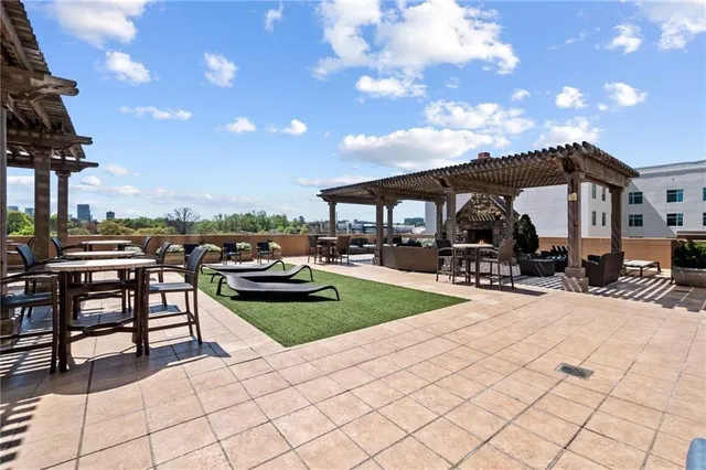 a view of a patio with dining table and chairs with a patio