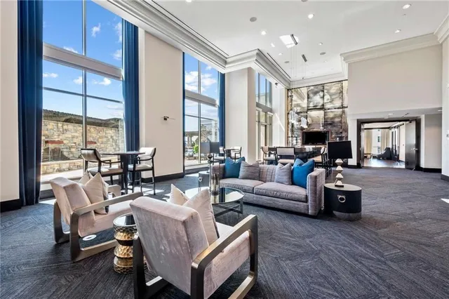 a living room with furniture or couch and a large window