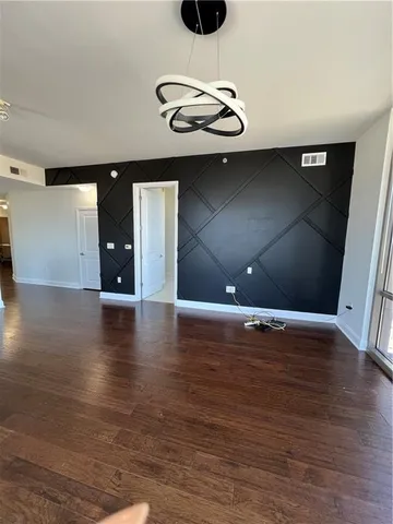 a view of a livingroom with wooden floor
