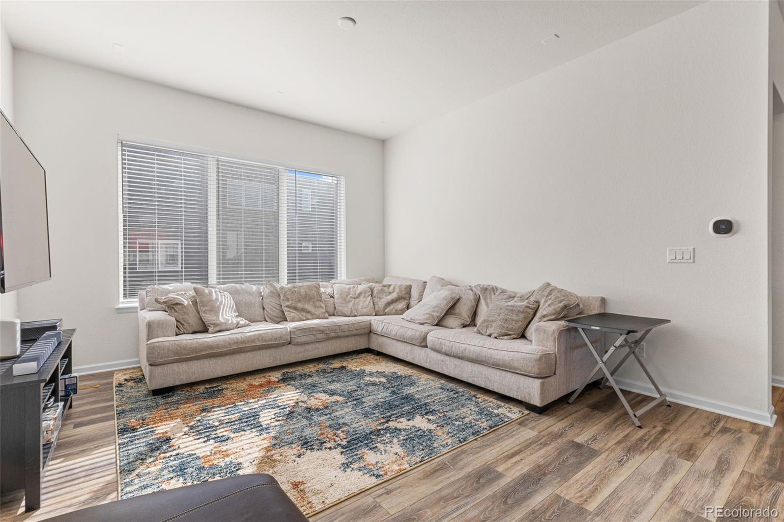 5173 Vivian Street Wheat Ridge, CO 80033 - Photo 11 of 31 a living room with furniture and a large window