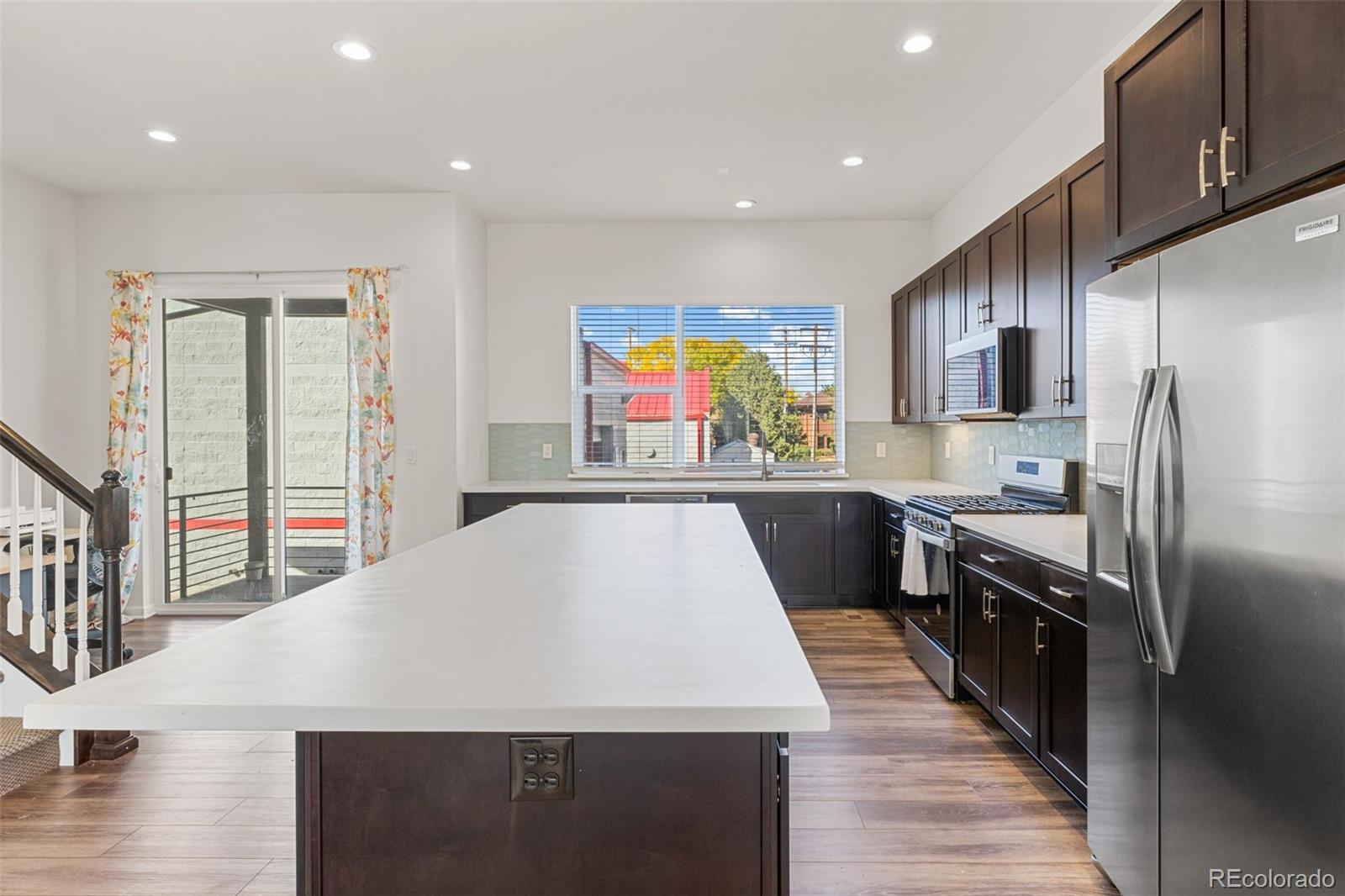 5173 Vivian Street Wheat Ridge, CO 80033 - Photo 15 of 31 a very nice looking kitchen with a large window