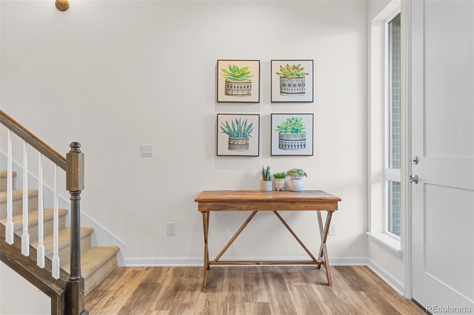 5173 Vivian Street Wheat Ridge, CO 80033 - Photo 8 of 31 a view of an entryway with wooden floor