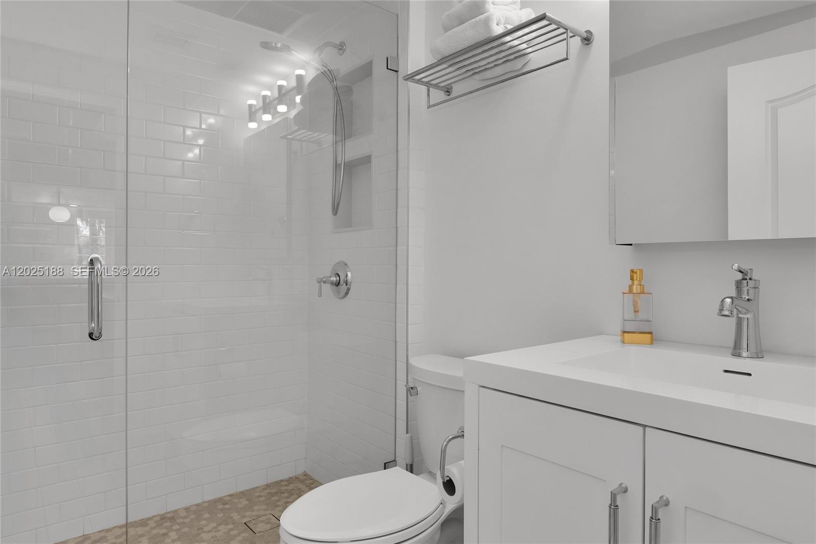 7620 Southwest 102nd Street, Unit 121 Pinecrest, FL 33156 - Photo 14 of 18 a bathroom with a sink toilet and shower