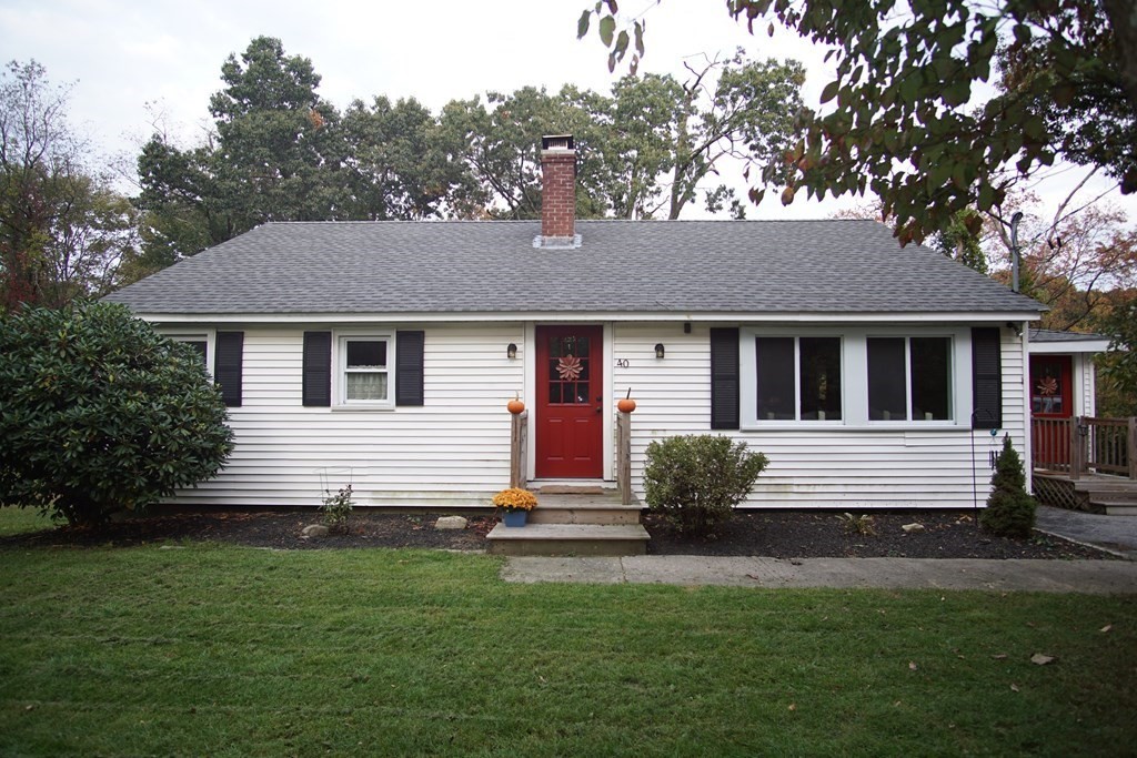40 Marble Road Sutton, MA 01590 - Photo 1 of 16 a front view of a house with a yard