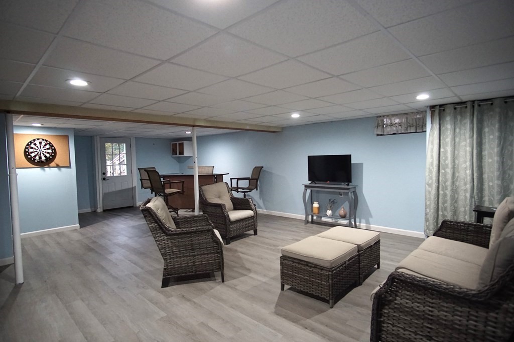 40 Marble Road Sutton, MA 01590 - Photo 12 of 16 a living room with furniture and a flat screen tv