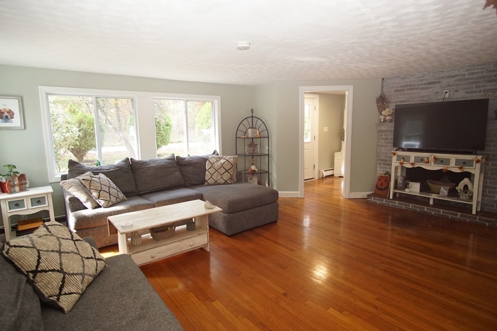 40 Marble Road Sutton, MA 01590 - Photo 5 of 16 a living room with furniture and a fireplace