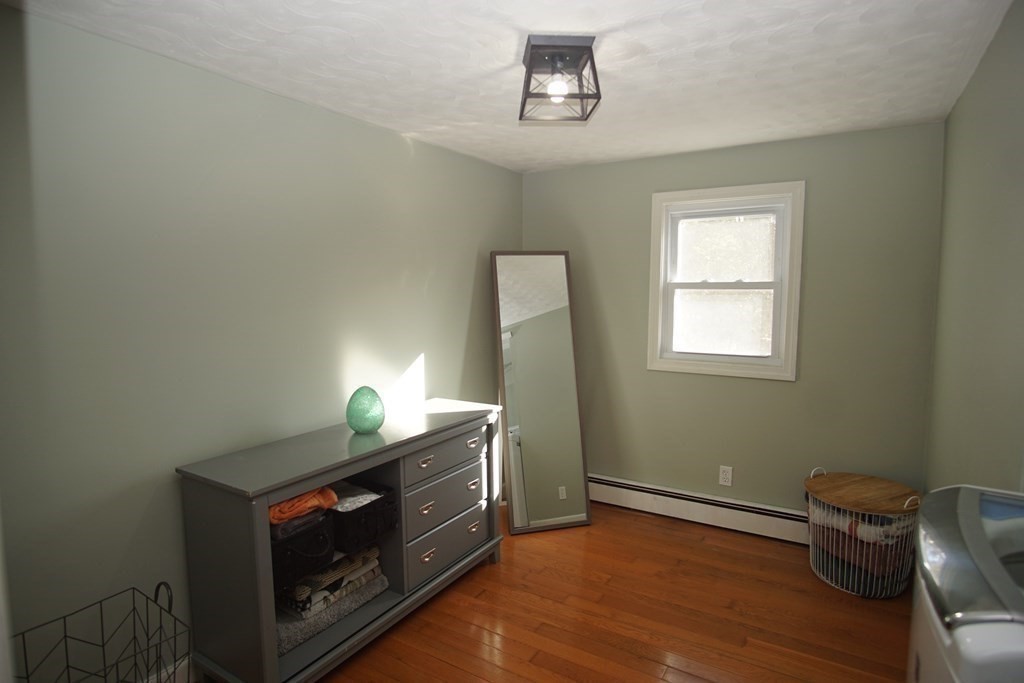 40 Marble Road Sutton, MA 01590 - Photo 8 of 16 a room with a fireplace and wooden floor