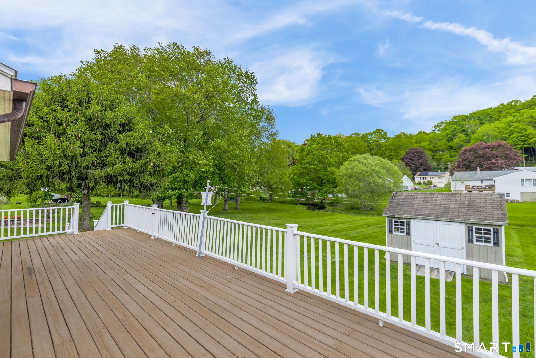 102 Wayne Lane Meriden, CT 06450 - Photo 30 of 36 a view of a wooden deck and a yard