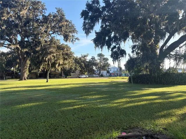 a view of a swimming pool with an outdoor space and seating
