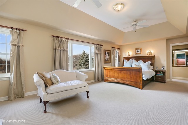 6040 South Grant Street Burr Ridge, IL 60527 - Photo 12 of 25 a bedroom with furniture and a large window