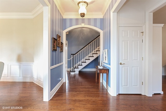 6040 South Grant Street Burr Ridge, IL 60527 - Photo 15 of 25 a view of entryway and hall with wooden floor