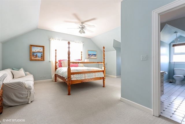 6040 South Grant Street Burr Ridge, IL 60527 - Photo 17 of 25 a bedroom with furniture and a ceiling fan