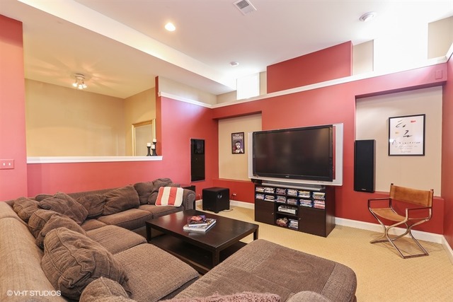 6040 South Grant Street Burr Ridge, IL 60527 - Photo 19 of 25 a living room with furniture and a flat screen tv