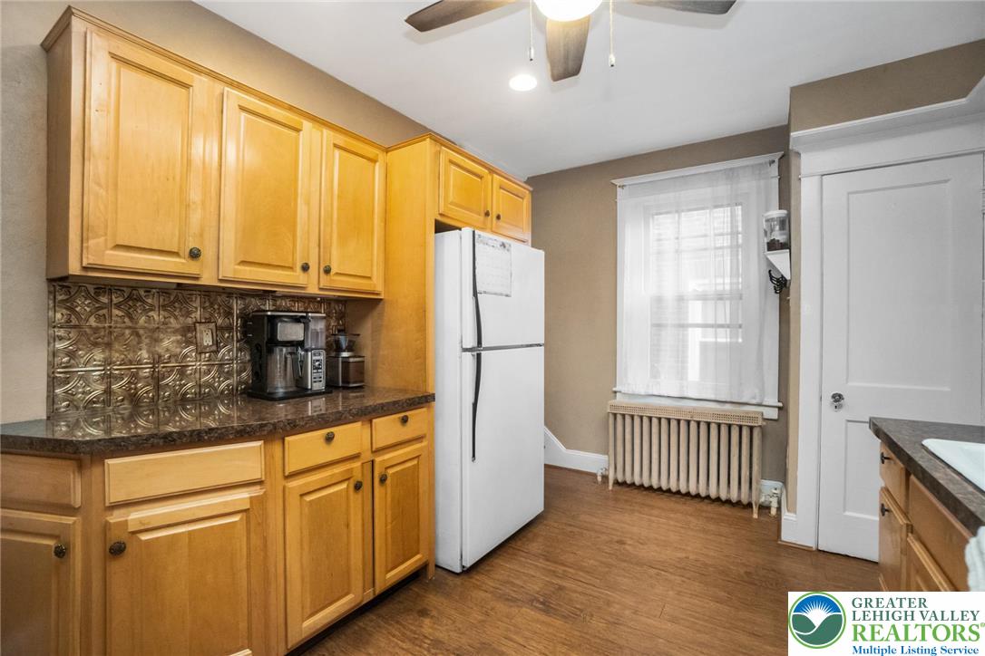 1209 Maple Street Bethlehem, PA 18018 - Photo 21 of 46 a kitchen with stainless steel appliances granite countertop a refrigerator and a sink