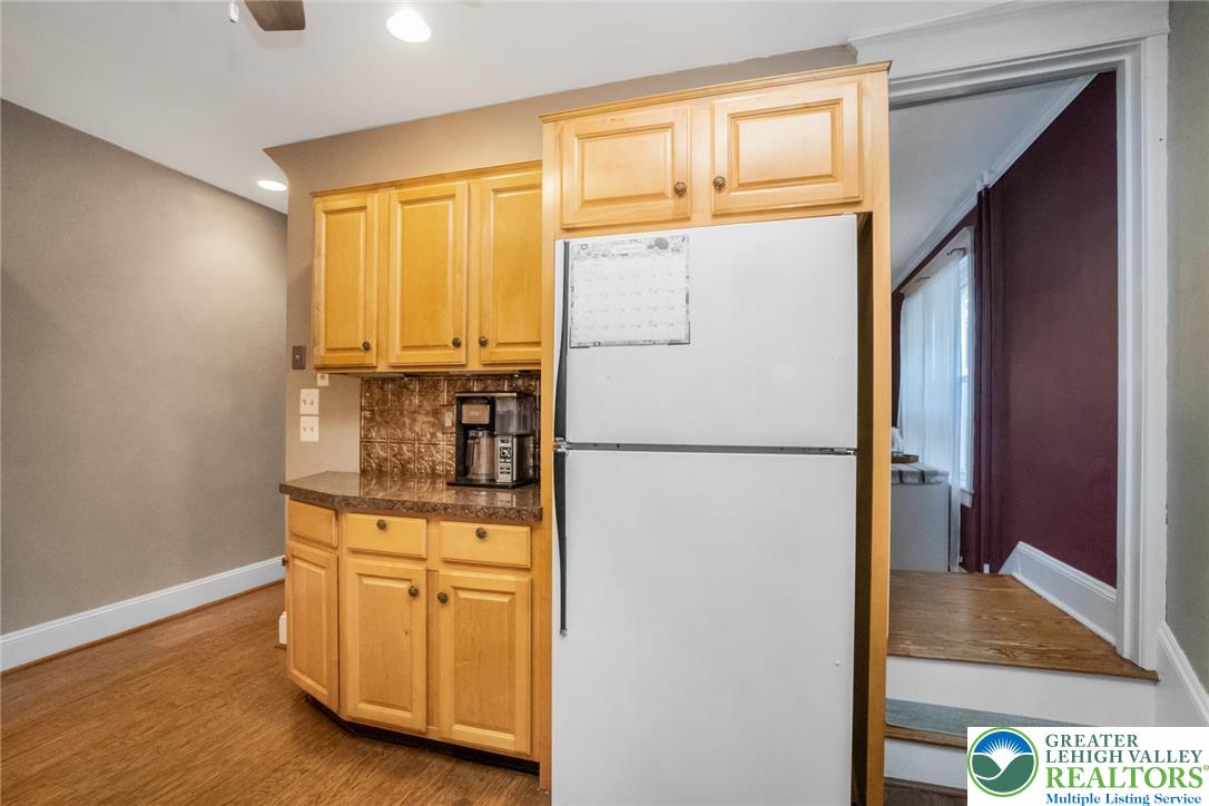 1209 Maple Street Bethlehem, PA 18018 - Photo 22 of 46 a white refrigerator freezer and a stove sitting inside of a kitchen
