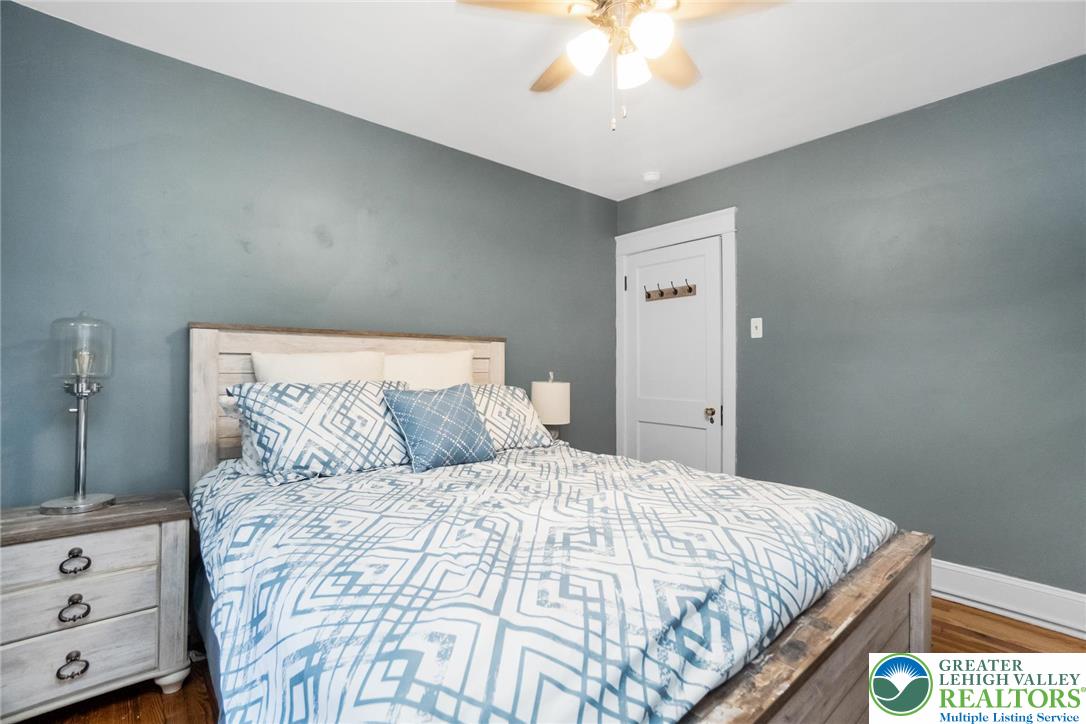 1209 Maple Street Bethlehem, PA 18018 - Photo 25 of 46 a bedroom with a large bed and a chandelier