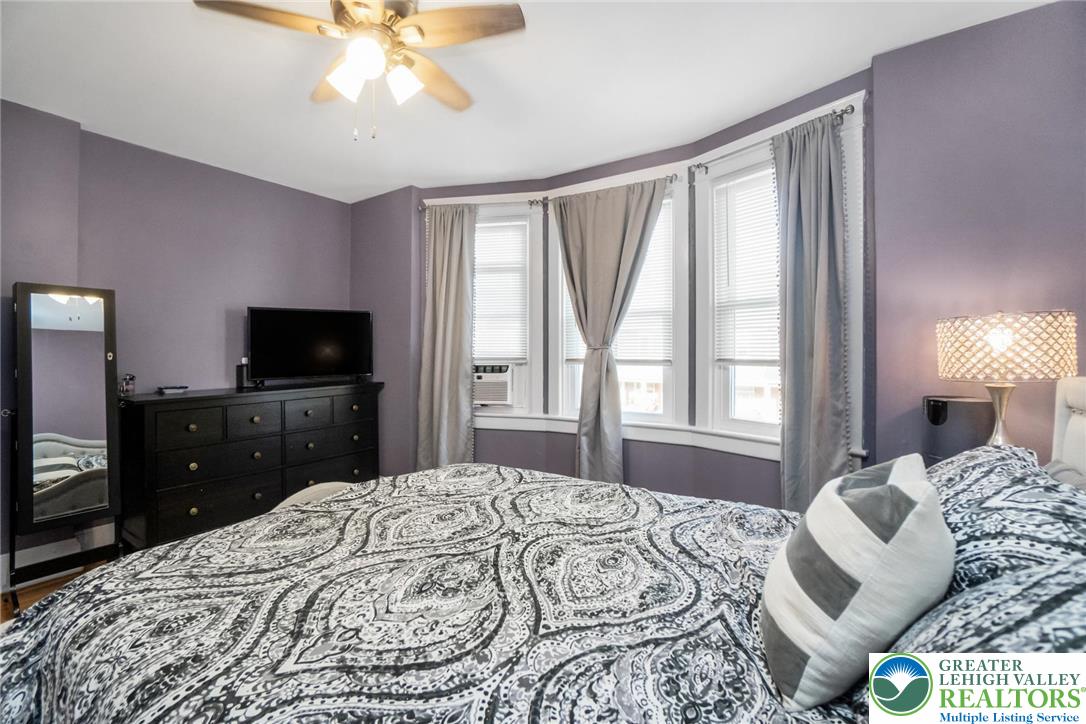 1209 Maple Street Bethlehem, PA 18018 - Photo 28 of 46 a bedroom with a bed and a flat screen tv