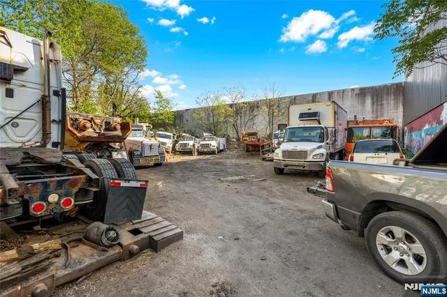 a view of a cars is parked on the side of the road