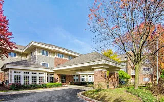 a front view of a building with a lot of windows