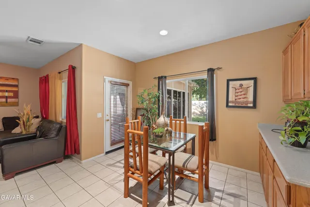 a dining room with furniture and window