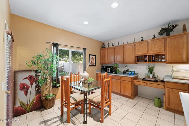 a kitchen with stainless steel appliances kitchen island granite countertop a sink and cabinets