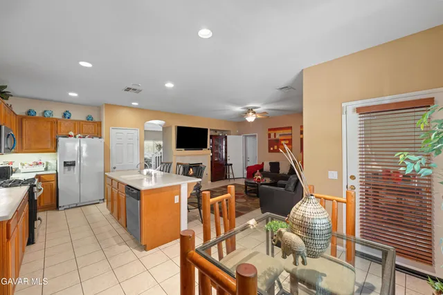 a view of a kitchen with cabinets and furniture
