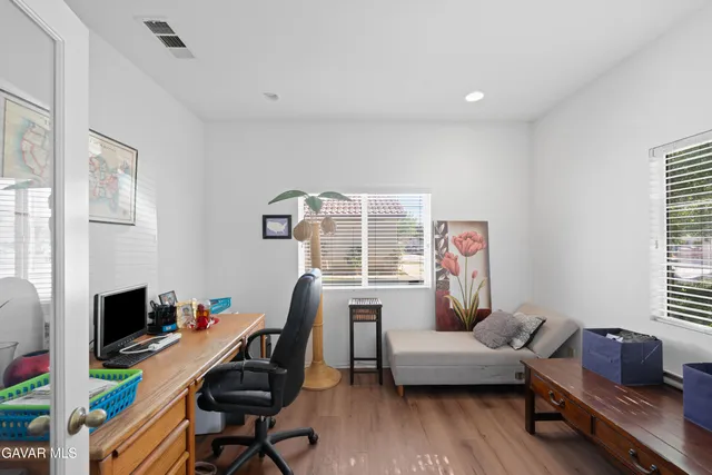 a work room with furniture and a window